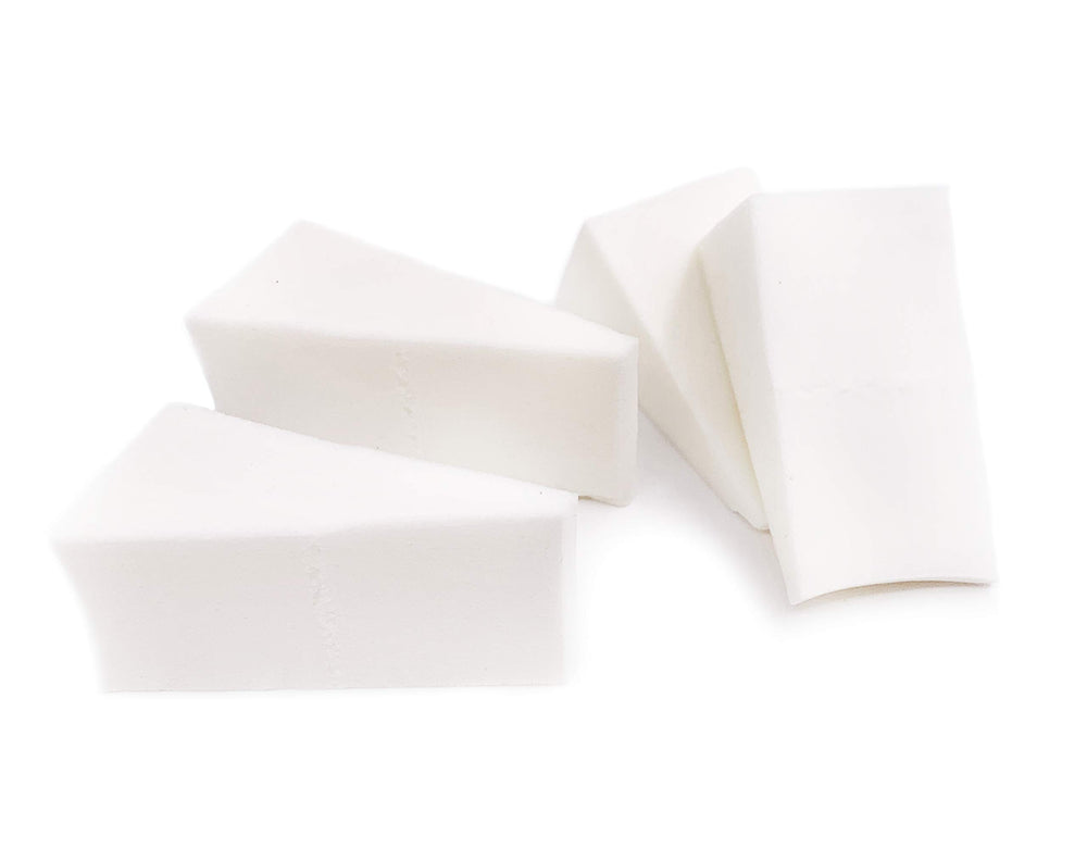 Artist's Choice triangle sponge close-up shows crisp edges for precise makeup blending.