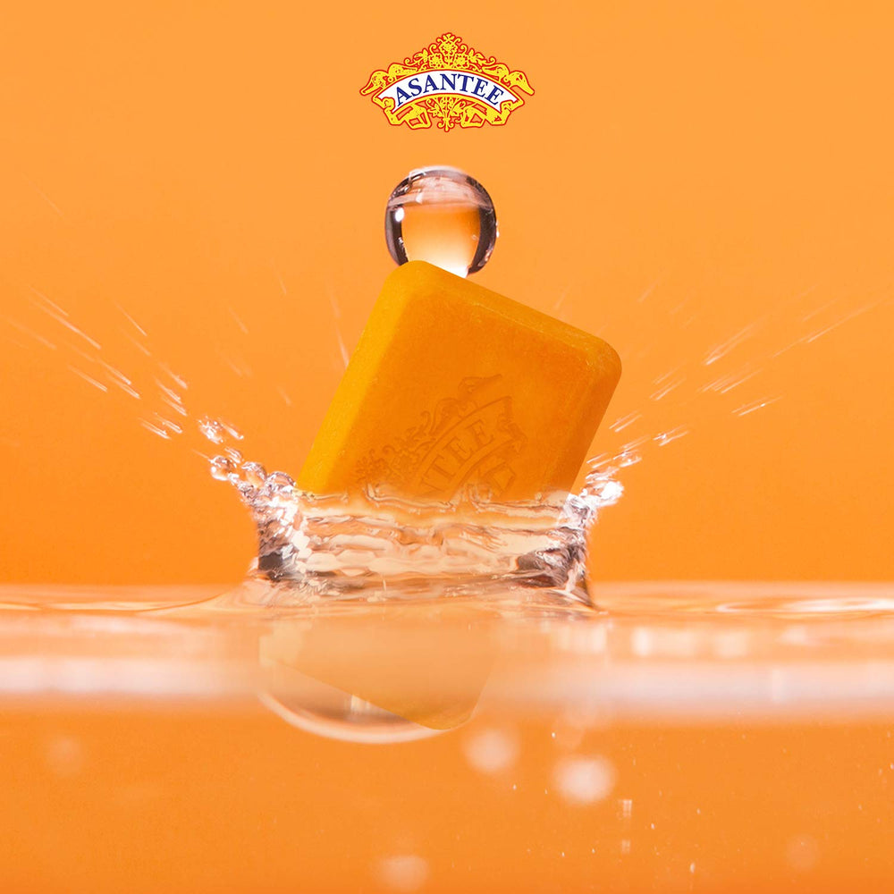 ASANTEE papaya-honey soap bars with honey and papaya slices for brightening daily rituals.