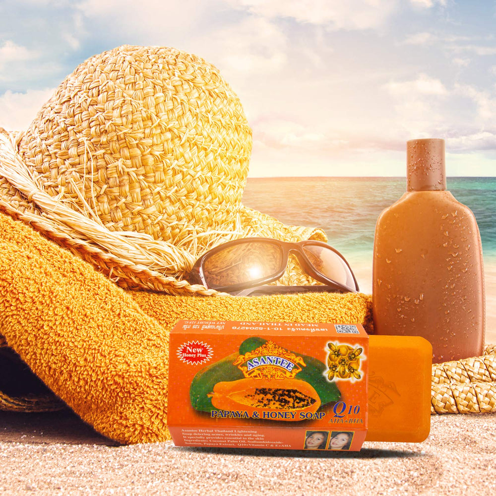 ASANTEE papaya-honey soap bars in water bubbles showing moisturizing cleanse.