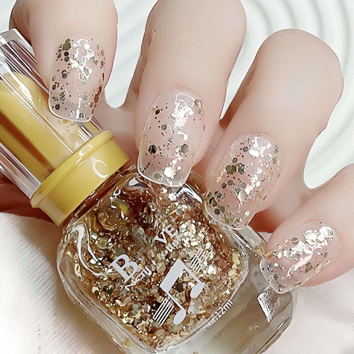 ASMAYSA Clear Sparkle Top Coat bottle showing reflective glitter for a glamorous finish.