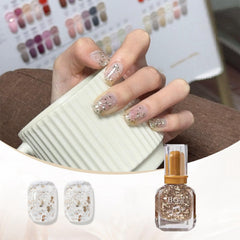 ASMAYSA glossy gold shimmer nail art catches light with high shine.