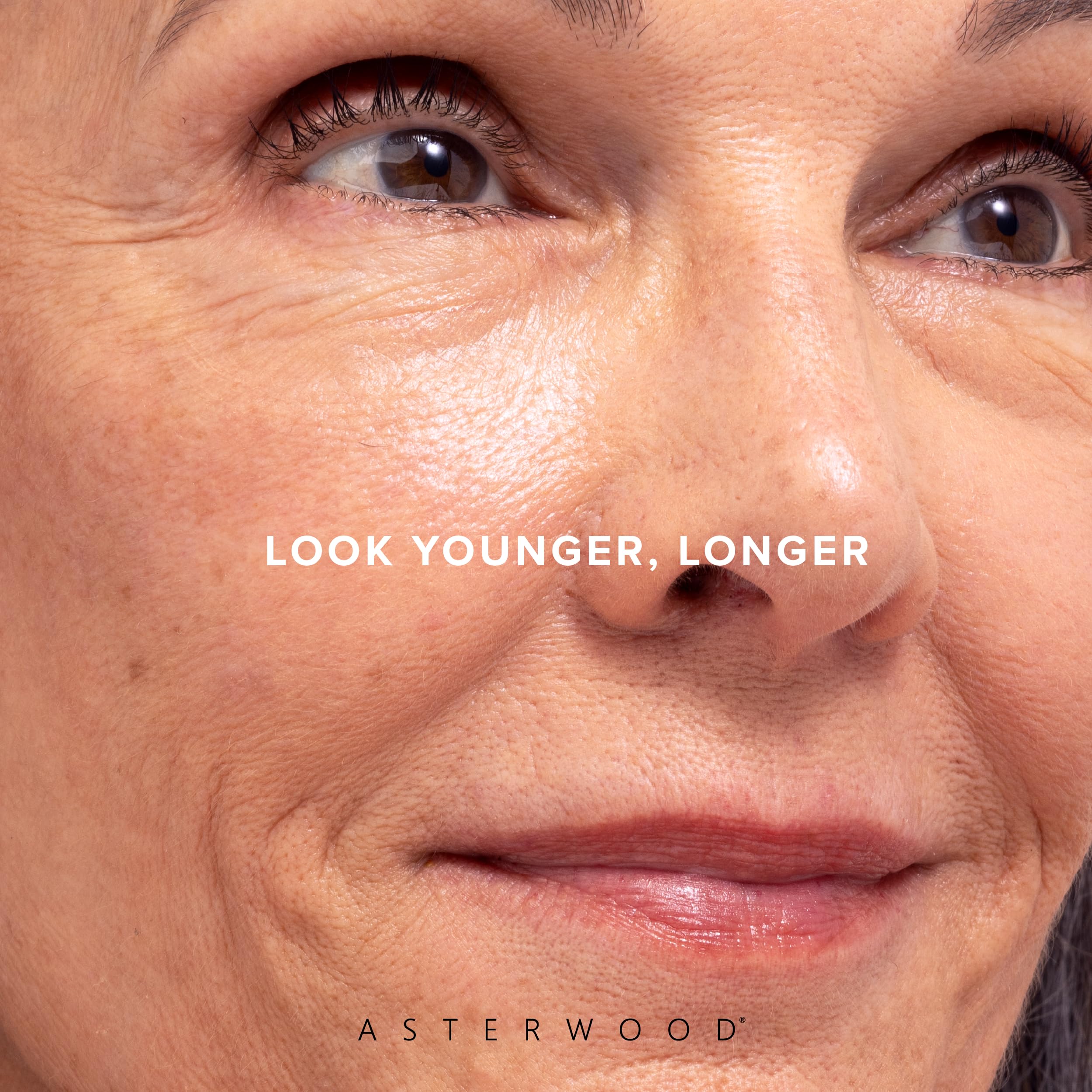 Nighttime skincare routine featuring Asterwood serum with soft lighting.