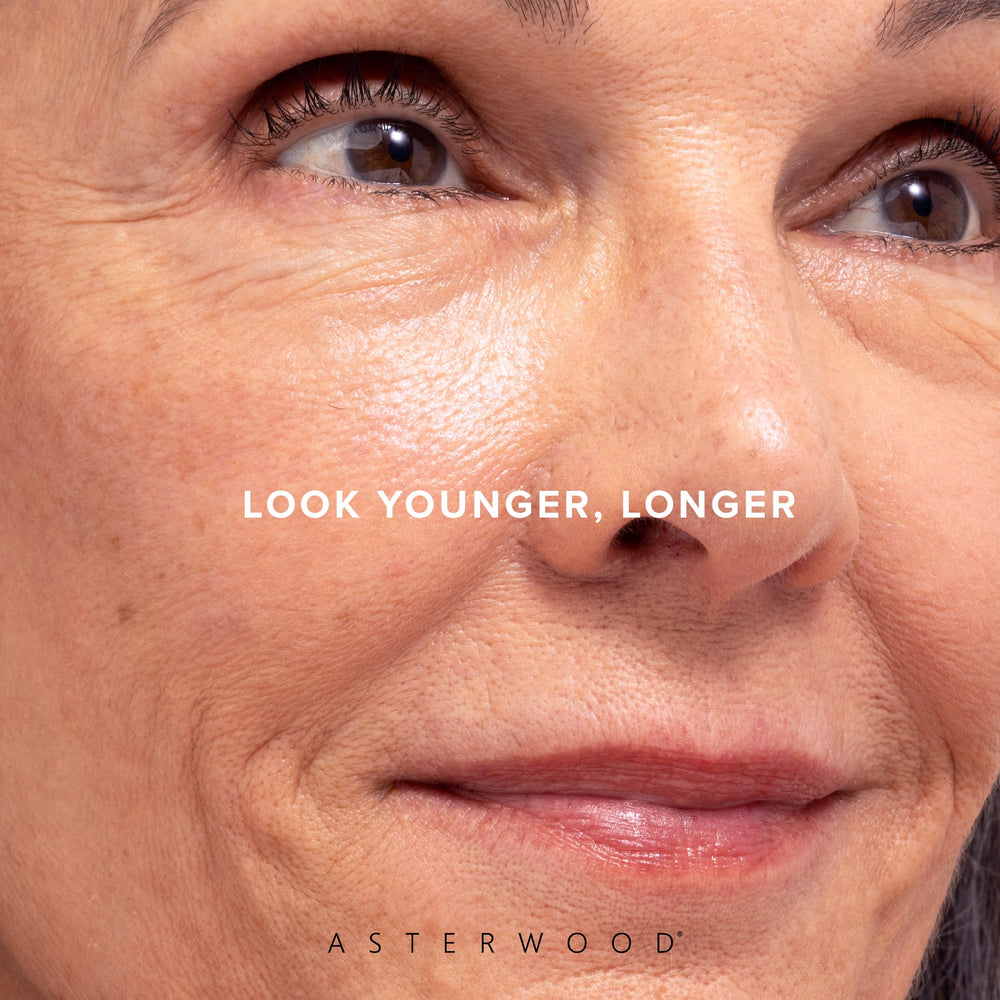 Nighttime skincare routine featuring Asterwood serum with soft lighting.