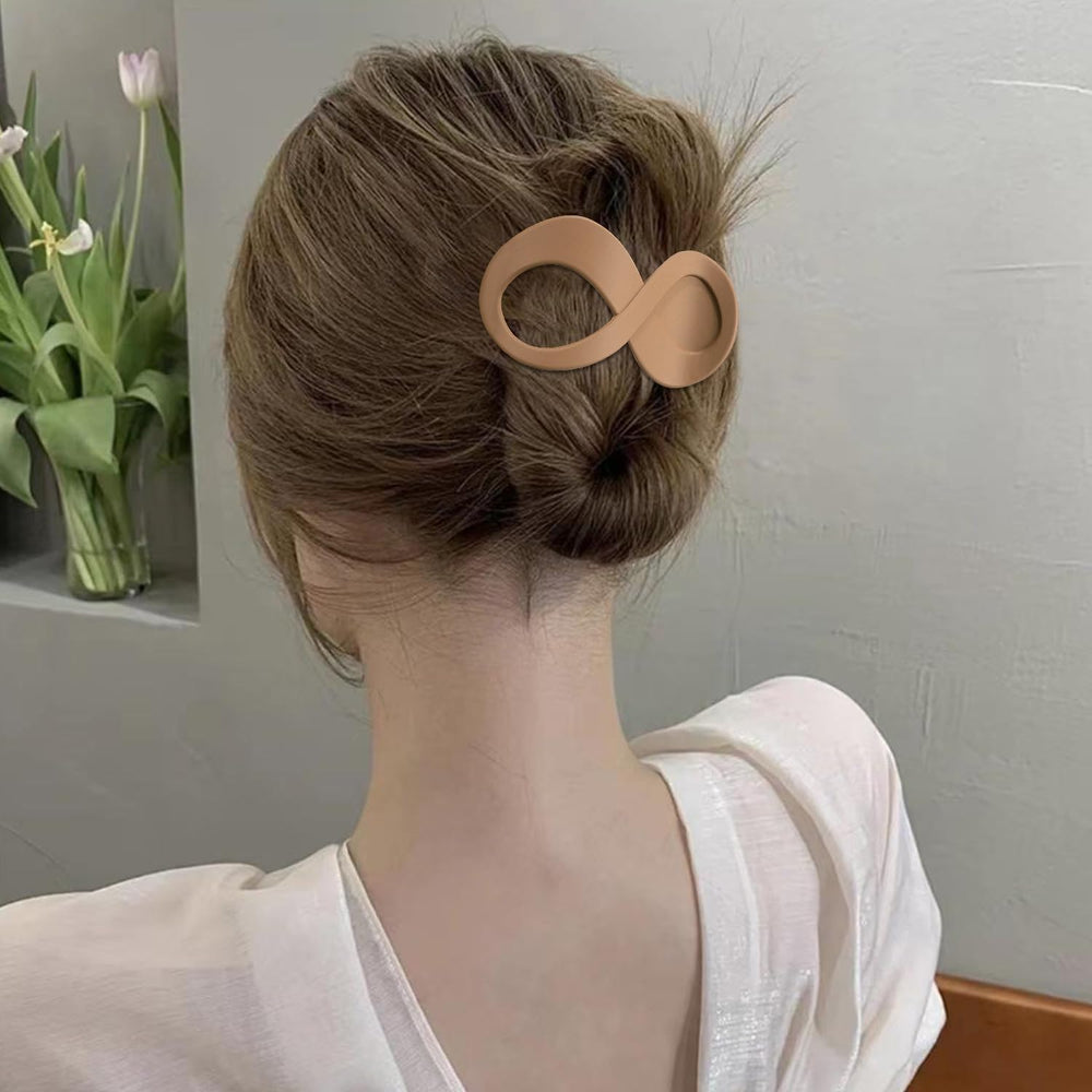 Atoden flat hair clips worn on back of head demonstrate gentle, comfortable grip.
