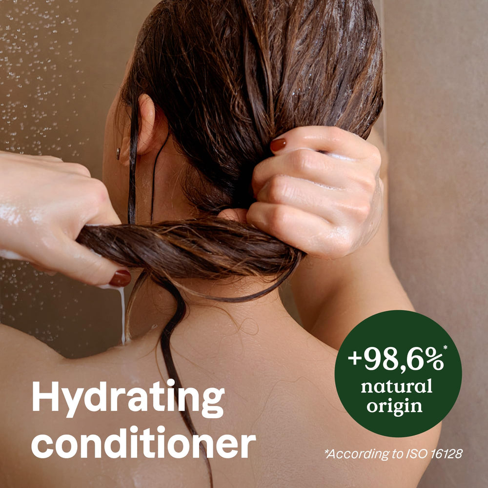 ATTITUDE Hydrating Conditioner hands applying for even moisture and glide.