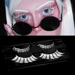 AUGENLI white lashes cosplay look close-up with dramatic contrast.
