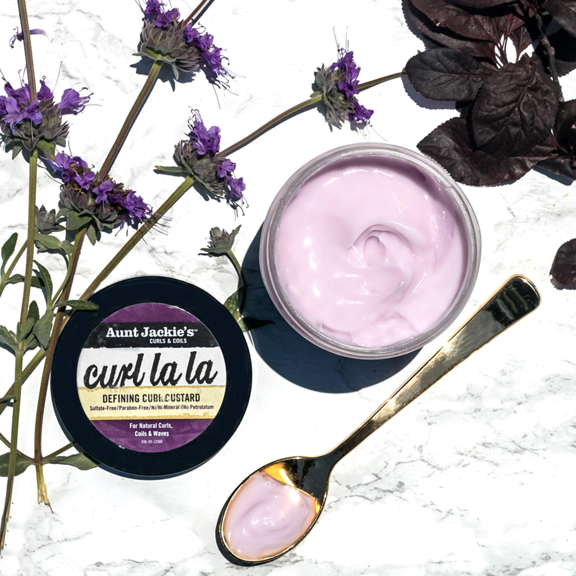 Aunt Jackie's Defining Custard on defined curls, showcasing shine and control.