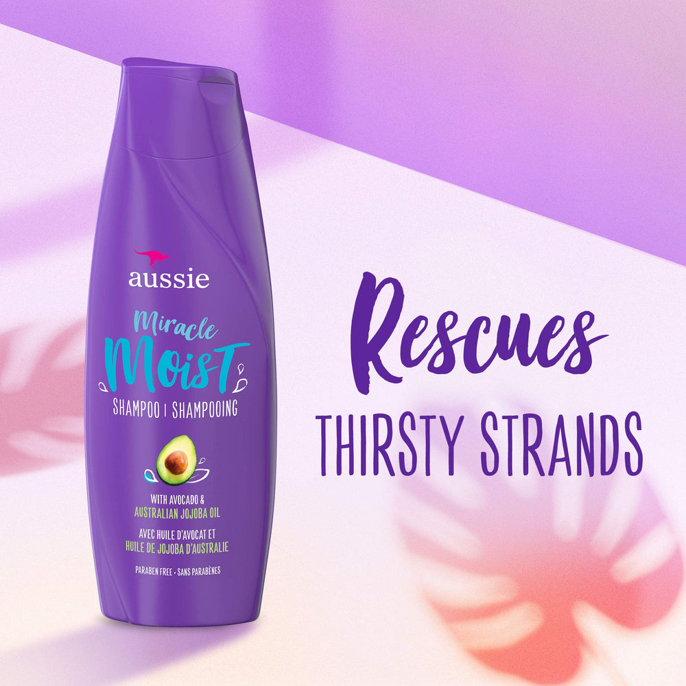 Aussie Miracle Moist conditioner bottle pour demonstrates slip and moisture for detangling.