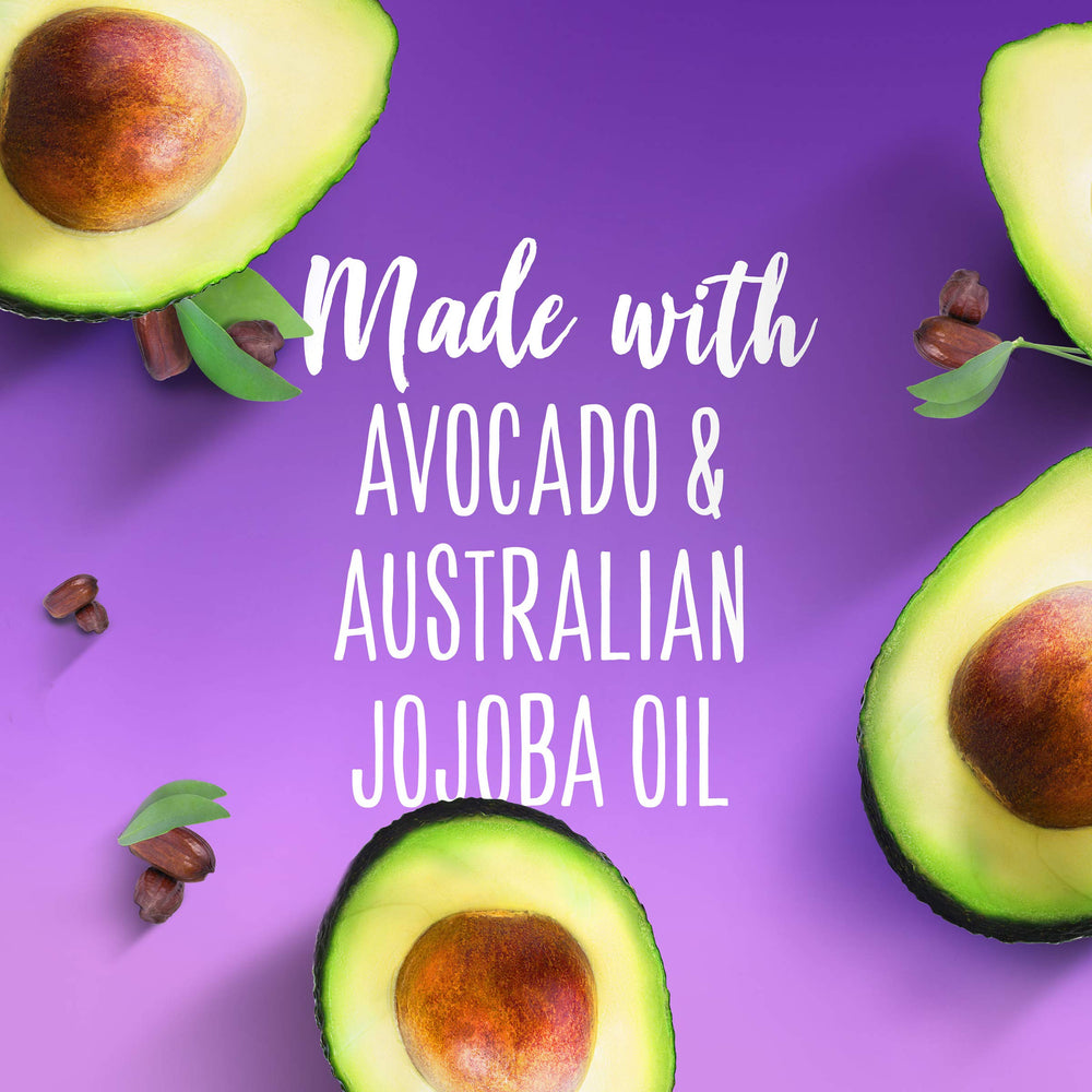 Aussie Miracle Moist shampoo bottle pour shows rich lather and hydration.