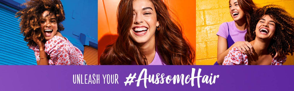 Aussie Miracle Moist shampoo close-up with foamy lather on hair.