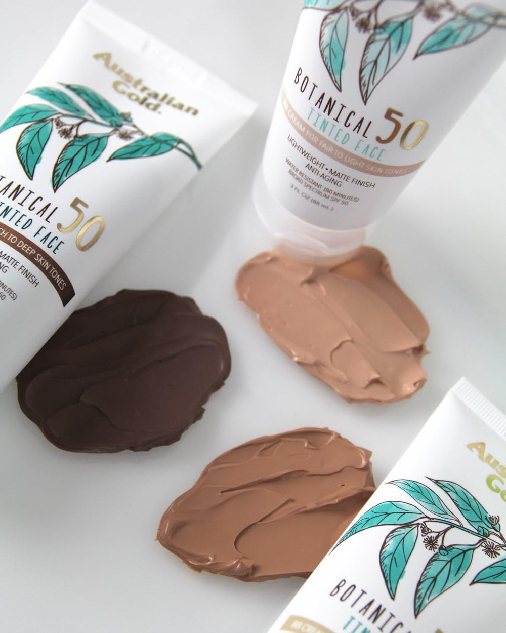 Australian Gold Botanical SPF 50 tinted sunscreen on fingertips with non-greasy matte layer