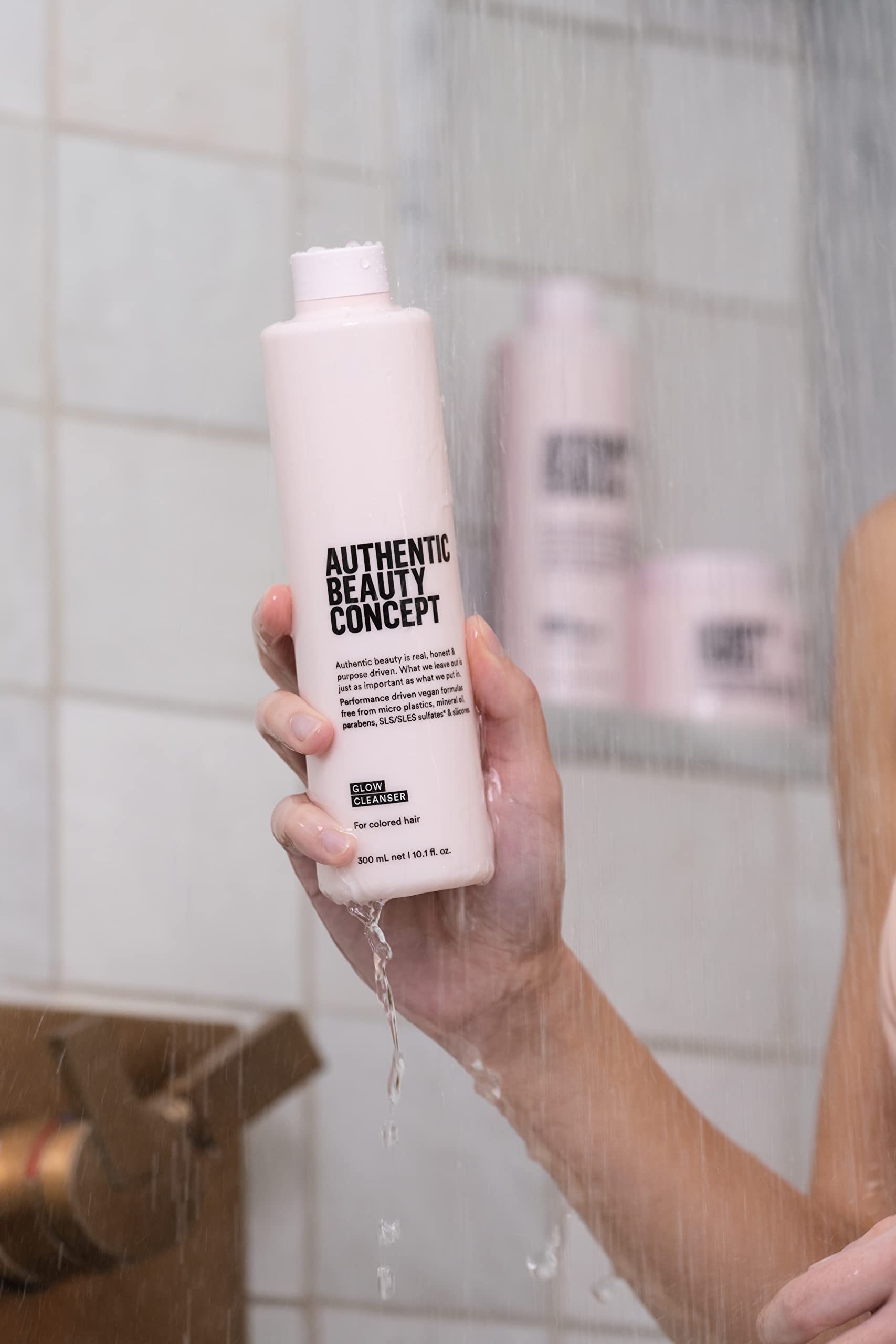 Authentic Beauty Concept Glow Cleanser pump-action shot conveys easy, mess-free use.