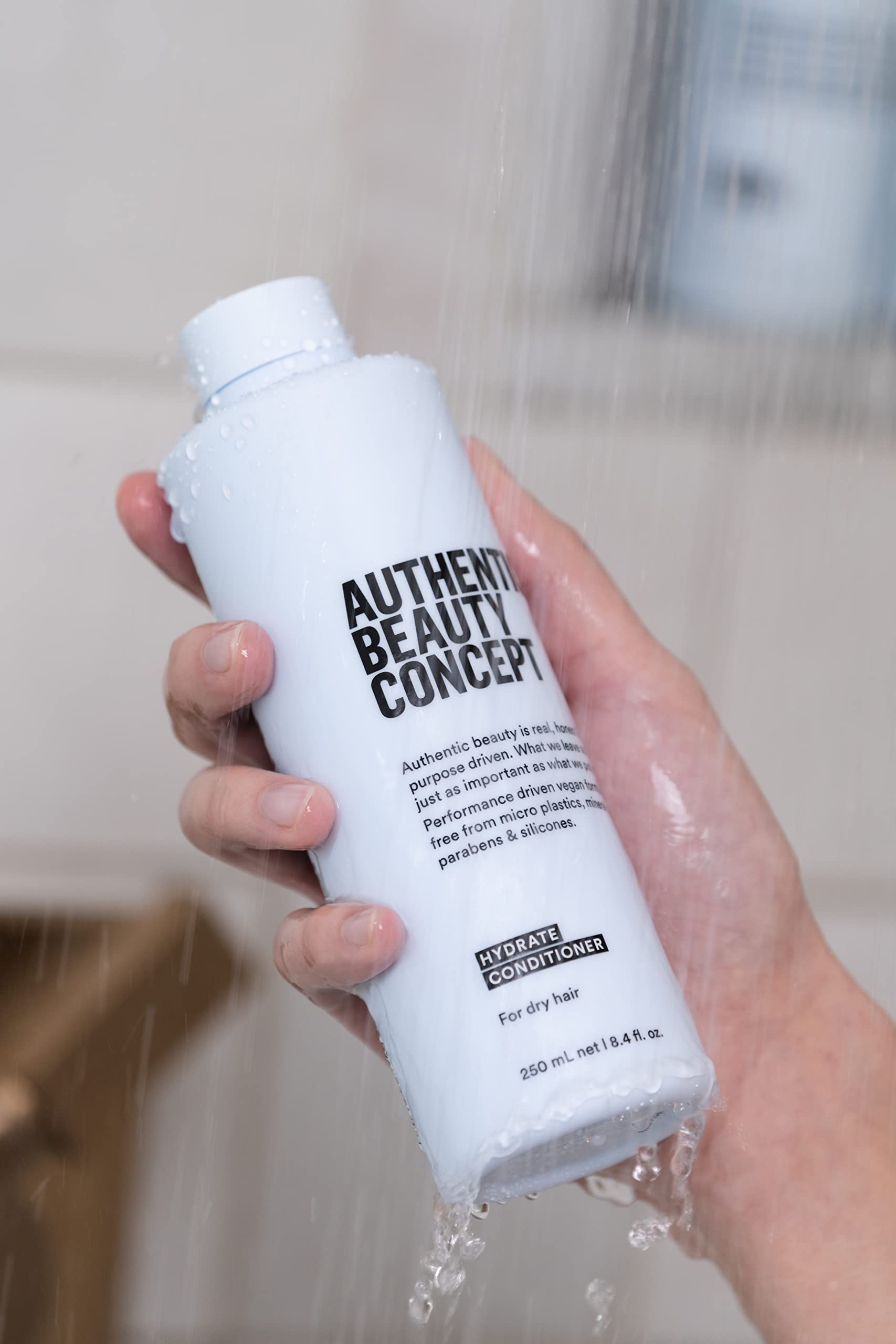Authentic Beauty Concept Hydrate Conditioner hair with tangles shows smoother, frizz-free finish