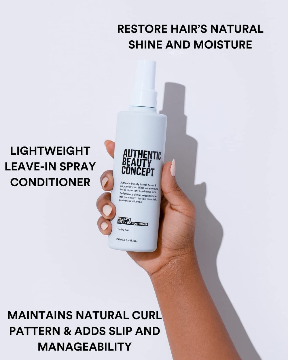 Hydrate Spray Conditioner mist application demonstrates slip for detangling and easy styling.