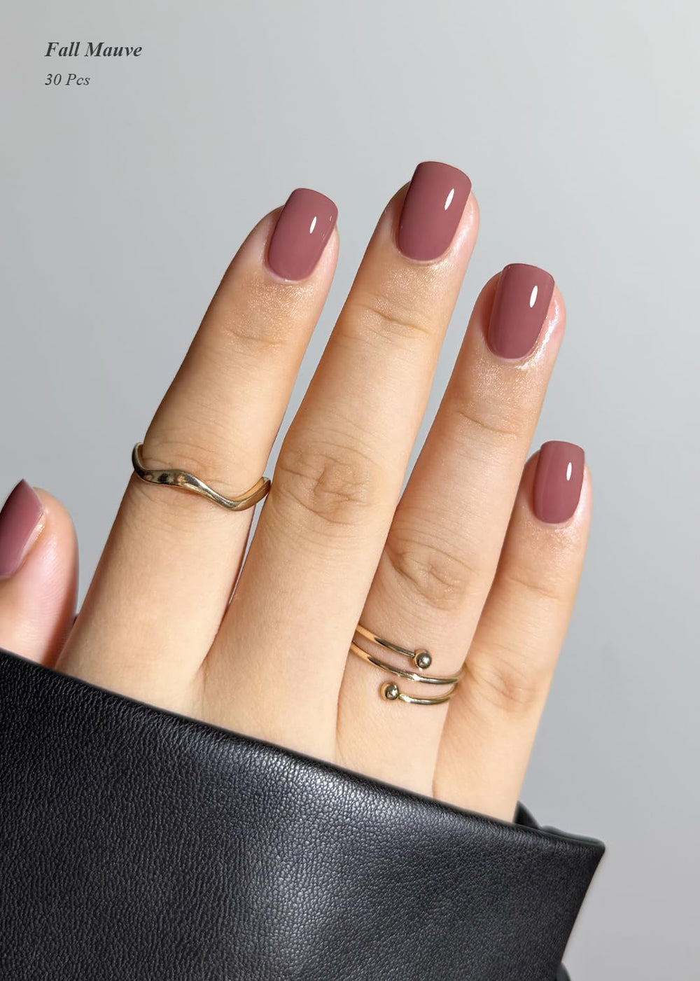 AutyaMee Fall Mauve gel strips in hand ready for easy application.