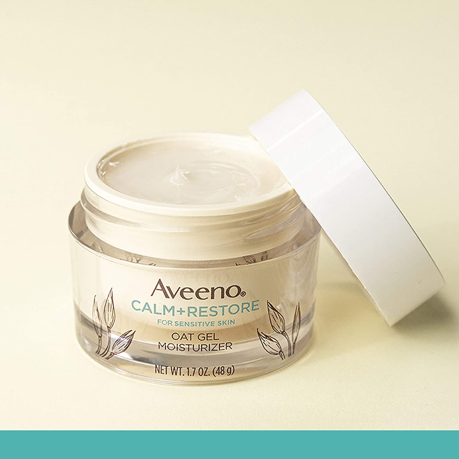 Aveeno Calm + Restore oat logo closeup signaling dermatologist-recommended, fragrance-free formulation.