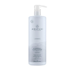 Awapuhi Wild Ginger HydraSoft conditioner bottle on counter for silky hydration.