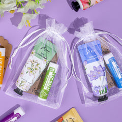 AZEN white organza bags provide elegant packaging for wedding or event favors.