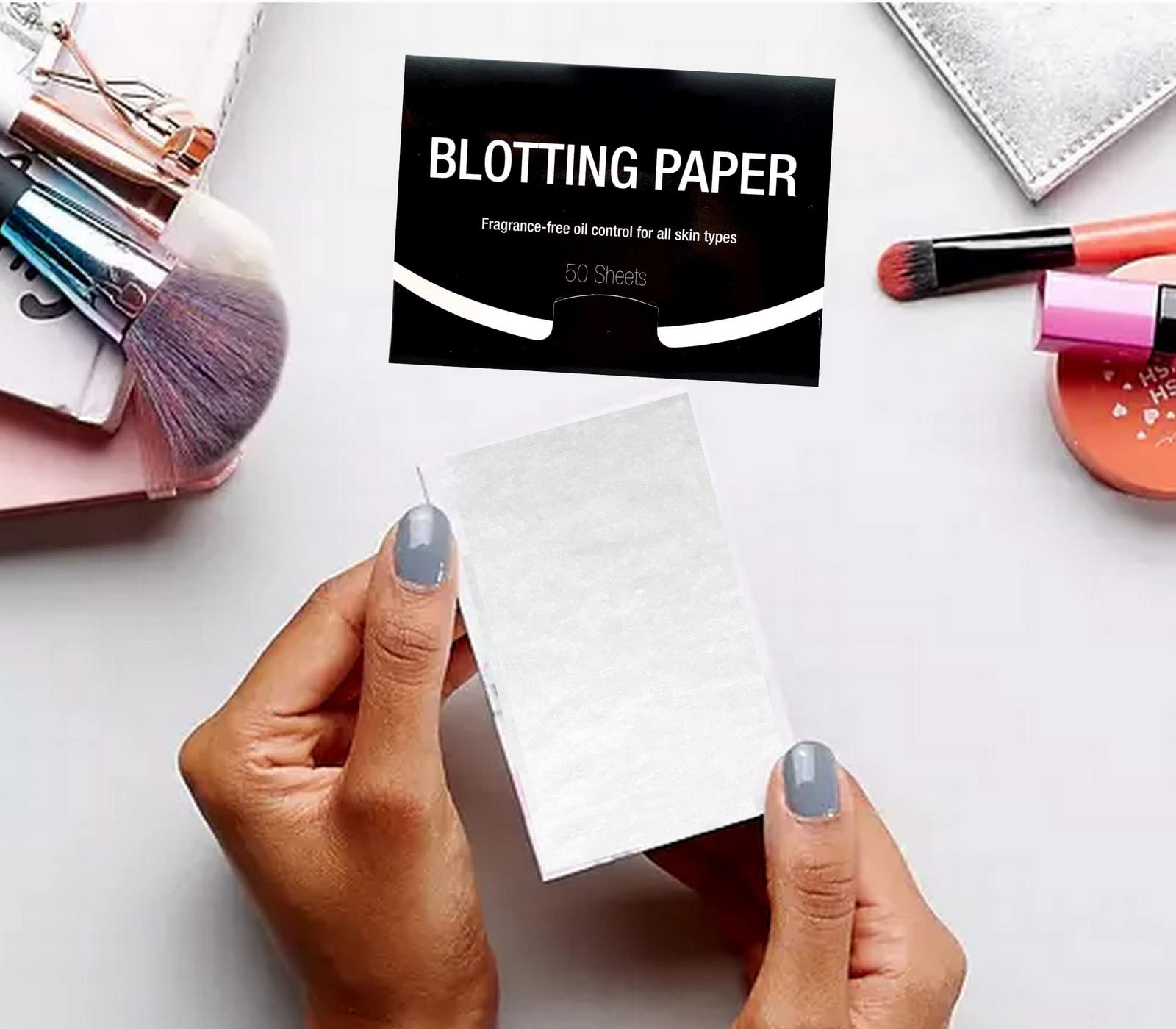 Azi blotting paper close-up demonstrates absorption of excess oil without disturbing makeup.