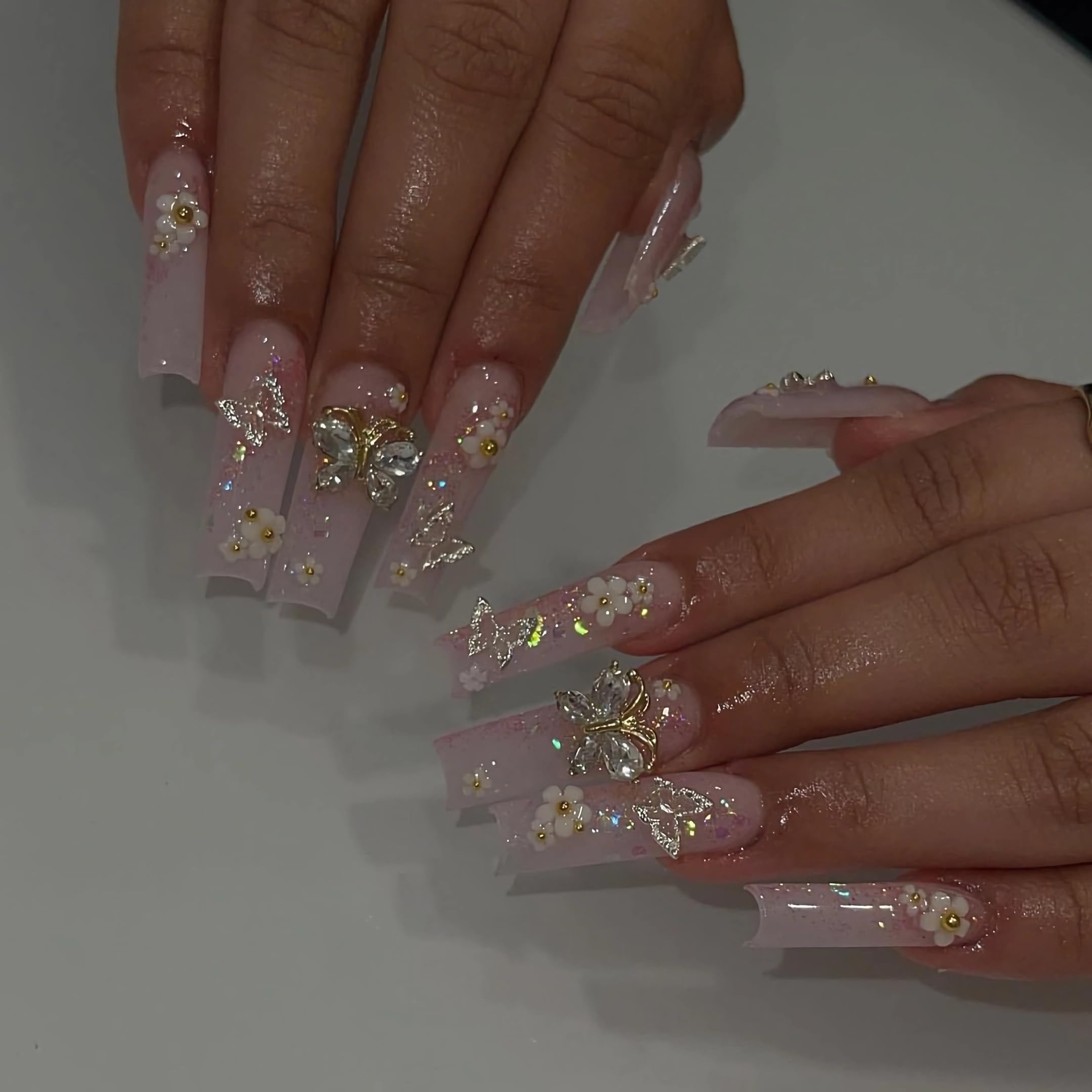 BABALAL long square nails in pink glitter shown up close for precision fit.