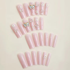 BABALAL nails with 3D butterfly charms for decorative flair.