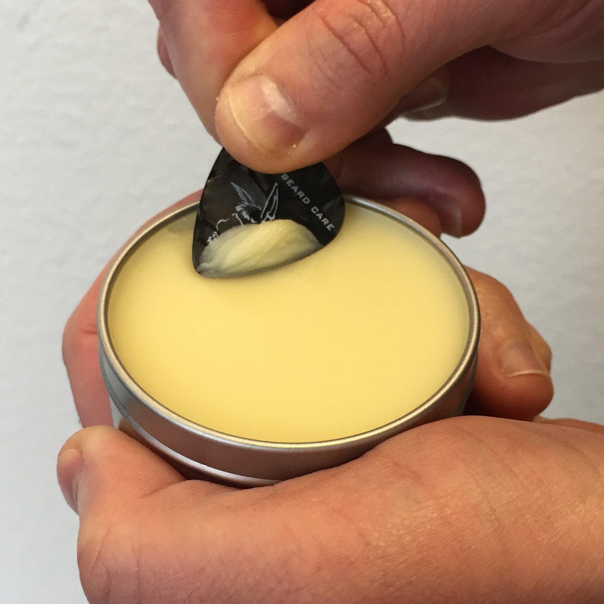 Badass Beard Care Beard Balm The Ladies Man Scent hands application demonstrates easy usage and long-lasting fragrance.