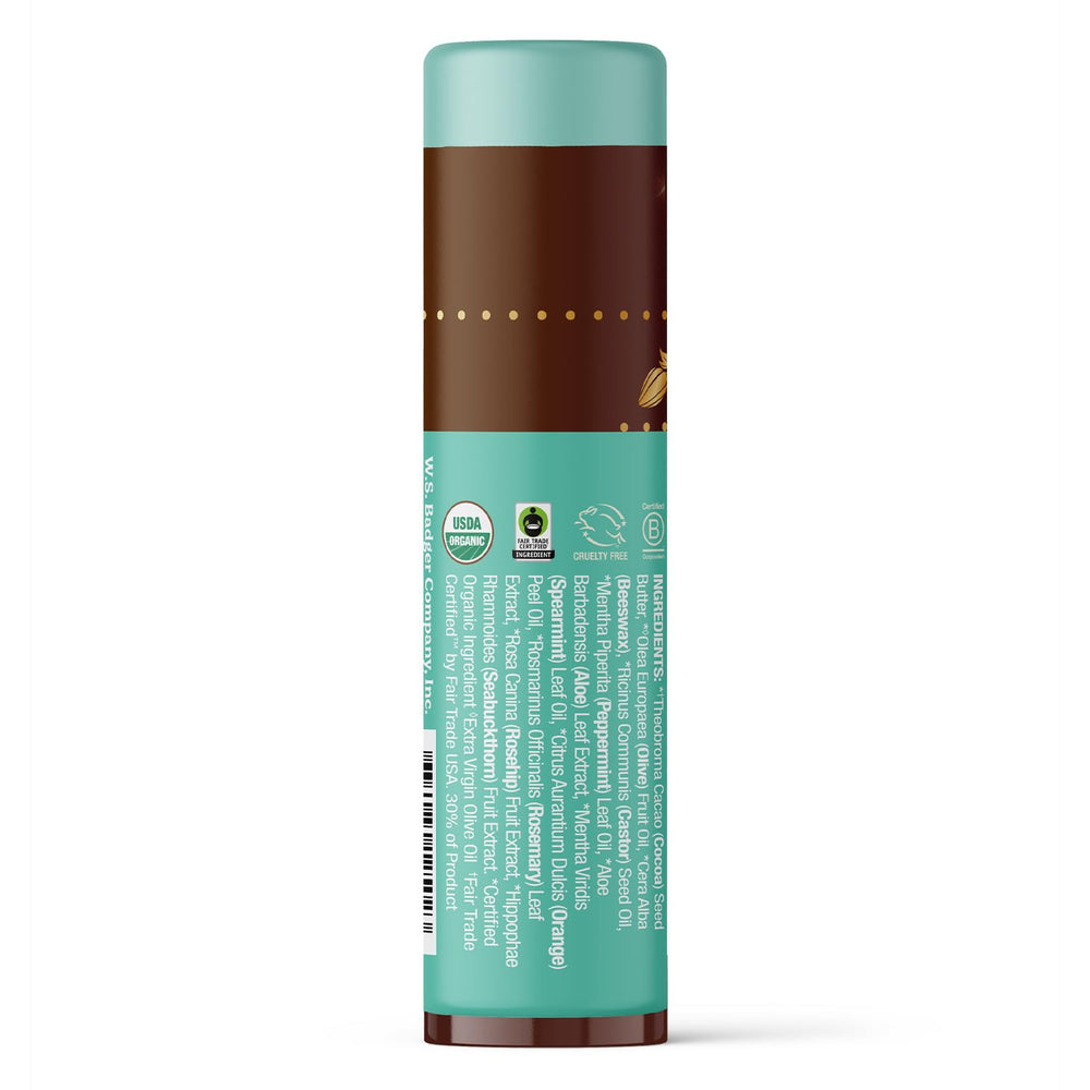 Badger lip balm stick twist reveals rich hydration and minty flavor for quick lip care.