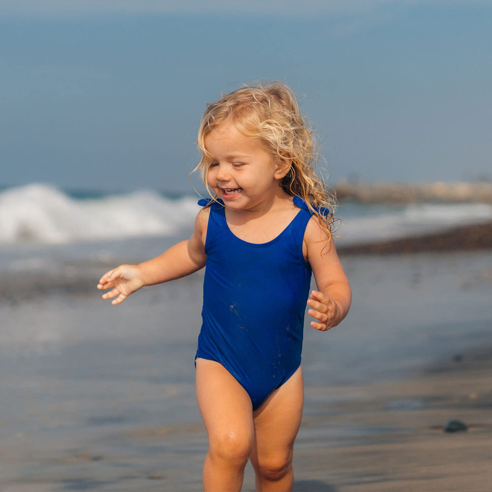 Badger Kids Mineral Sunscreen Hawaii-approved label photographed with tropical setting.