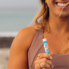 Badger SPF 15 reef-safe lip balm label emphasizes coral-friendly protection.