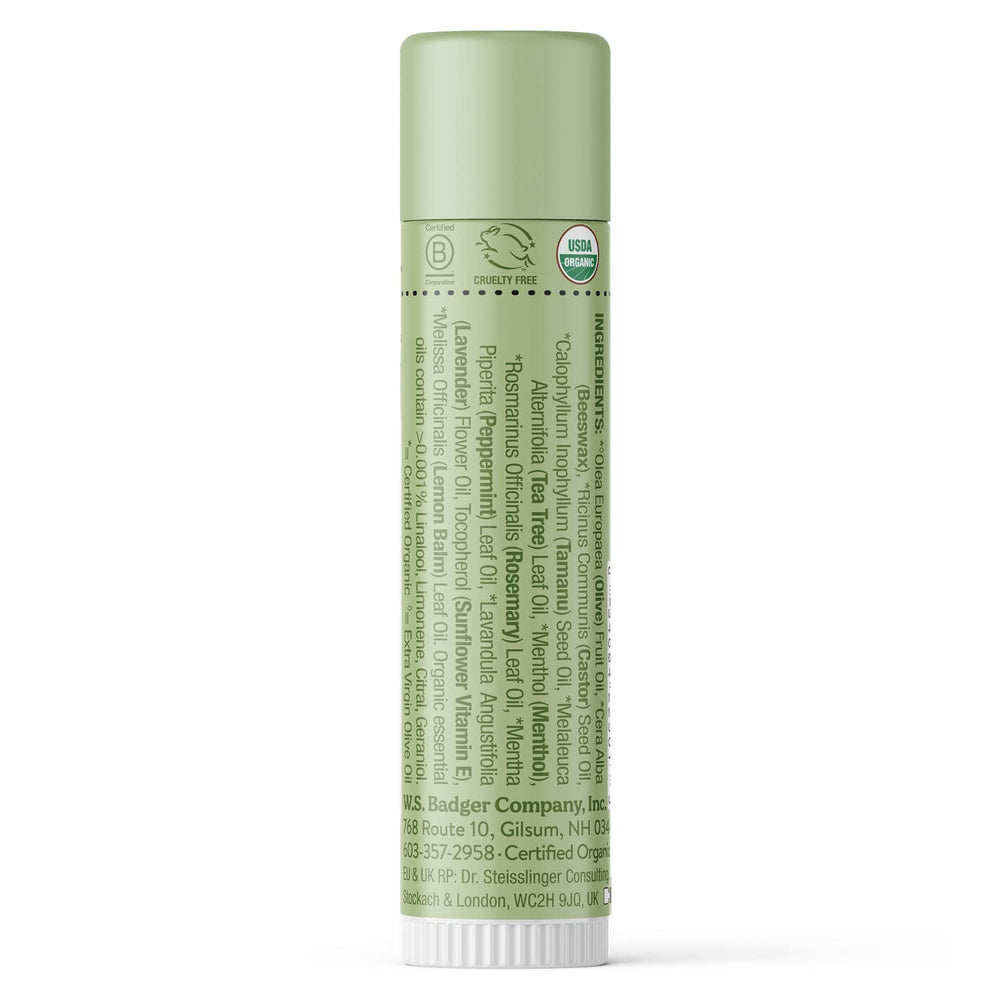 Badger Tea Tree Classic Lip Balm tube close-up showing silky glide and organic formula