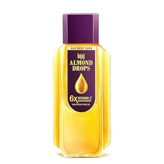 Bajaj Almond Drops oil pour demonstrates easy application for daily use