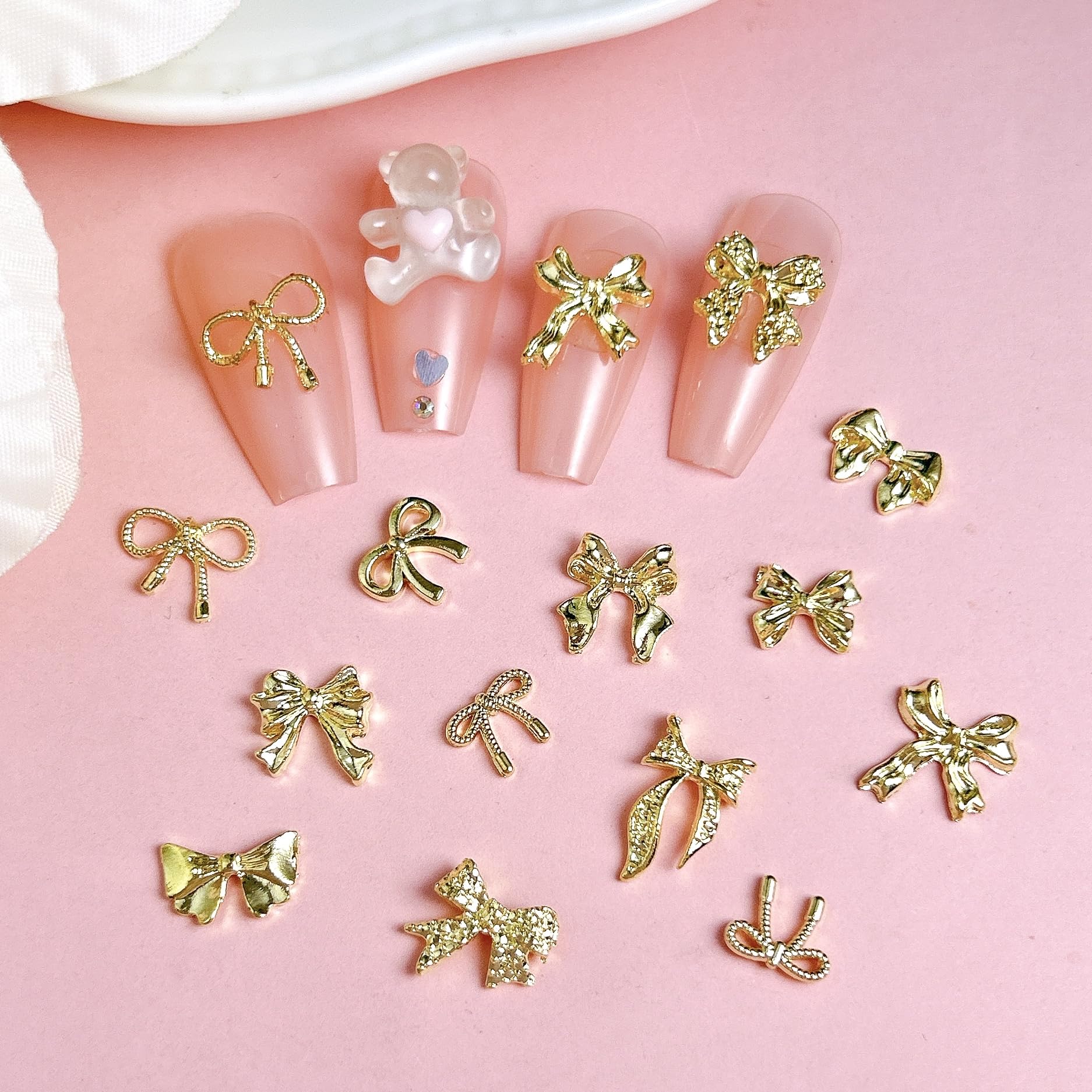BANA ART gold bow charms close-up demonstrates small size for delicate nail accents.