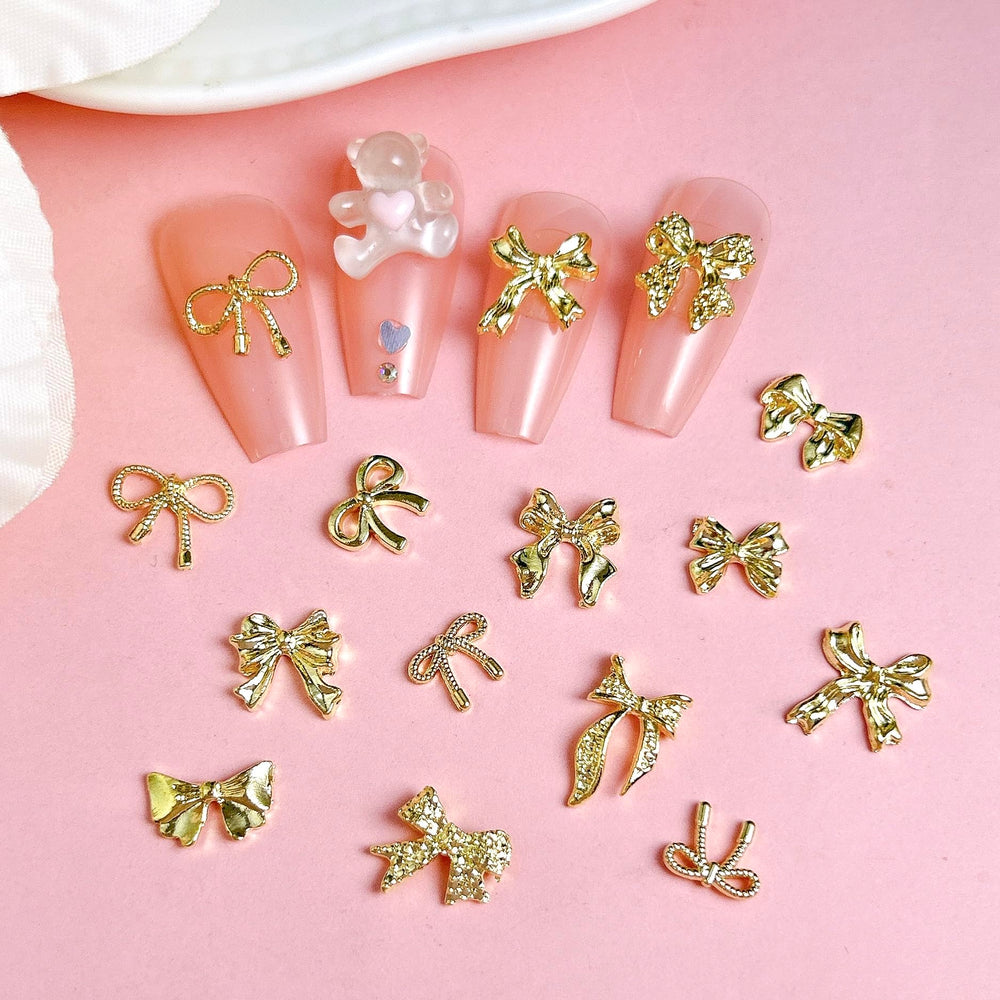 BANA ART gold bow charms close-up demonstrates small size for delicate nail accents.