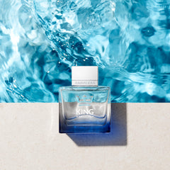 Banderas Antonio King of Seduction bottle on wood surface evokes warm, confident vibes