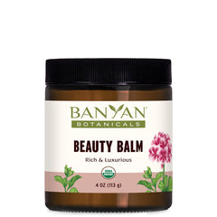Banyan Botanicals Beauty Balm jar close-up showing creamy texture for moisturized skin.