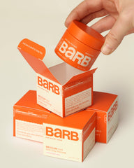 The Barb Shop pomade on hair offers smooth spread and clean rinse for quick daily styling.