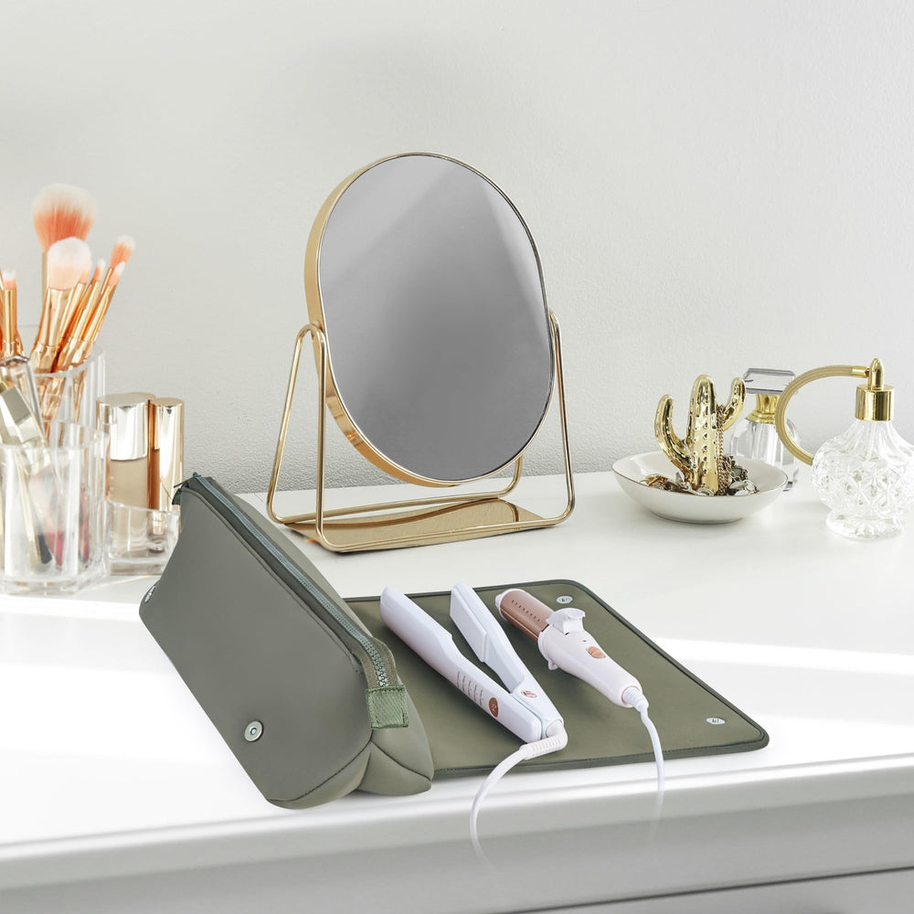 Barefoot Caribou Heat-Resistant Mat in-use with a hot tool protects countertops during styling