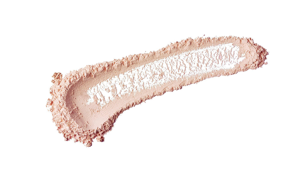 bareMinerals Mineral Veil Full Flawless Face Brush applying powder for seamless T-zone setting.