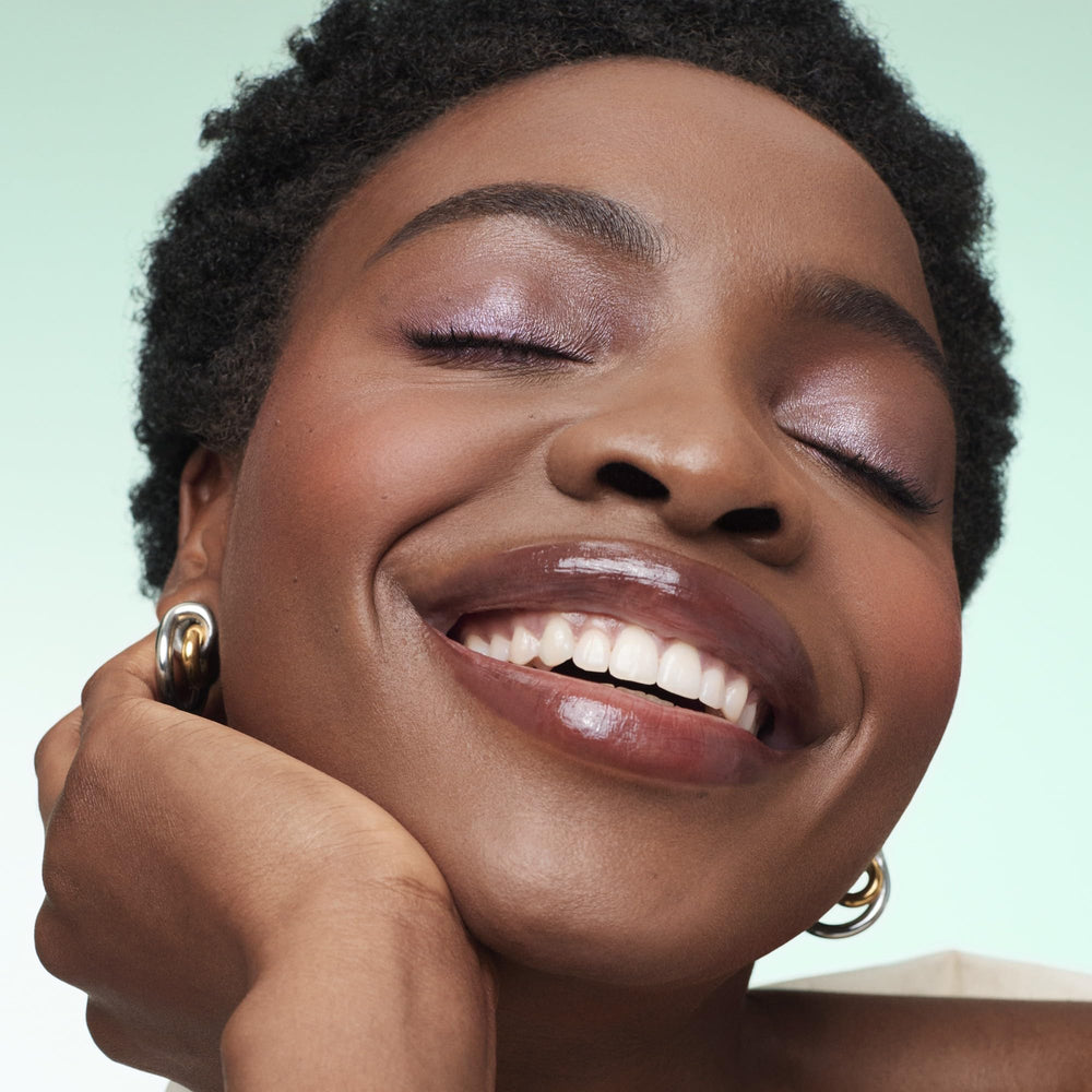 bareMinerals Mineralist Lip Gloss-Balm Serenity application for quick lip refresh and comfort.