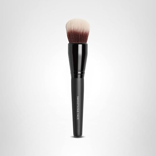 BareMinerals Smoothing Face Brush in use for even coverage with complexion Rescue gel.