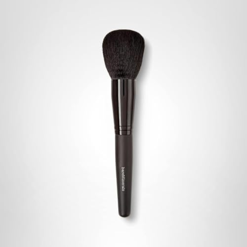 BareMinerals Supreme Finisher brush in use applying finishing powder for a soft, even glow.
