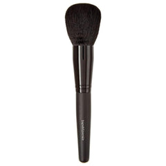 BareMinerals Supreme Finisher powder brush applying a sheer setting powder finish.