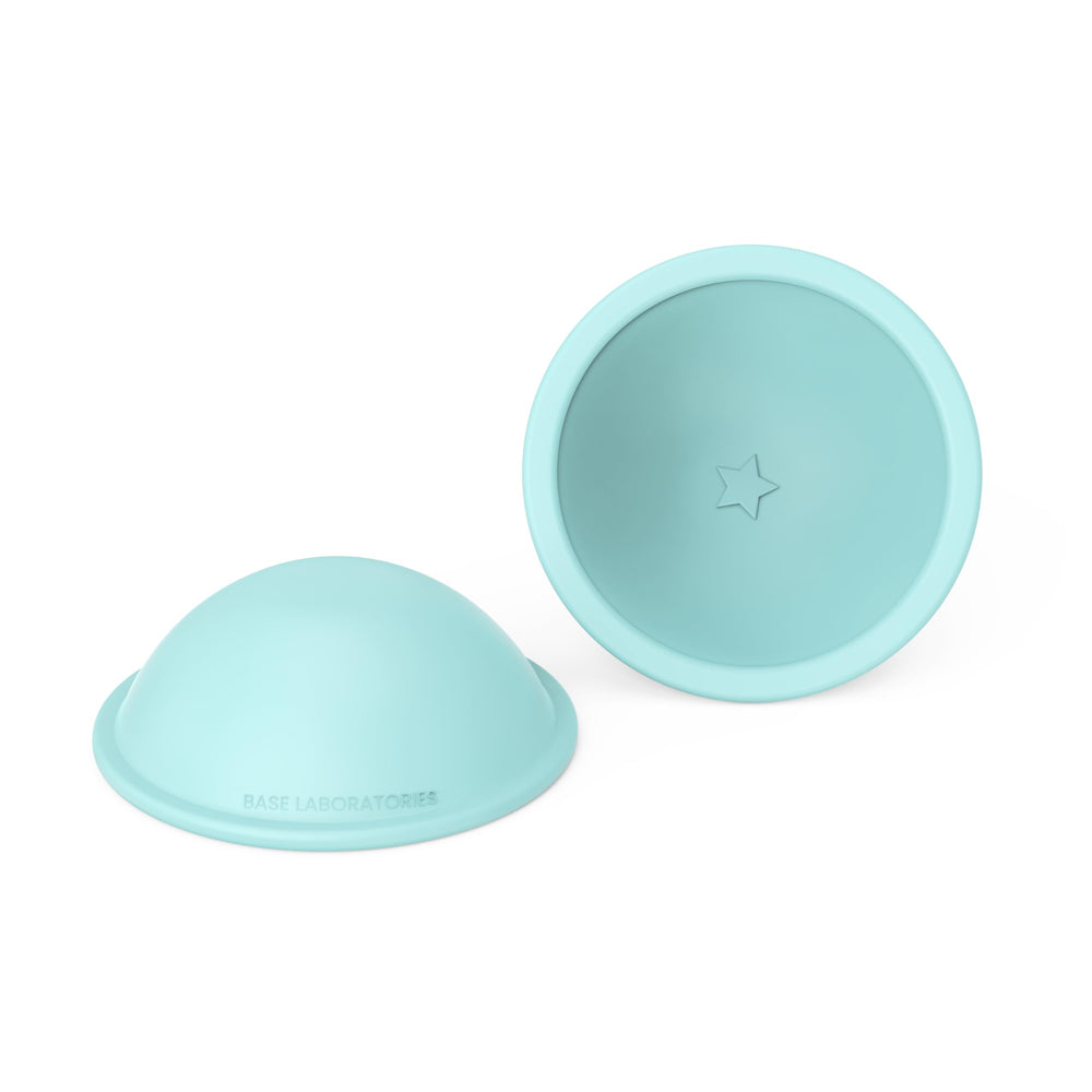 BASE LABORATORIES protective-comfort scene with cups acting as shields against irritation.