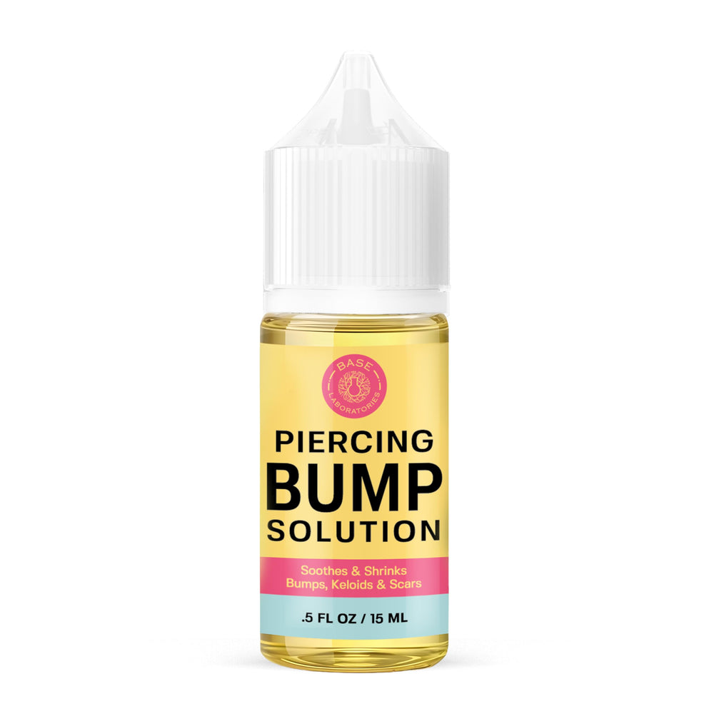 BASE LABORATORIES piercing bump solution bottle front view for soothing aftercare.