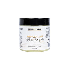 Bask and Lather stimulating scalp balm jar showcases mango and shea butter for nourishment.