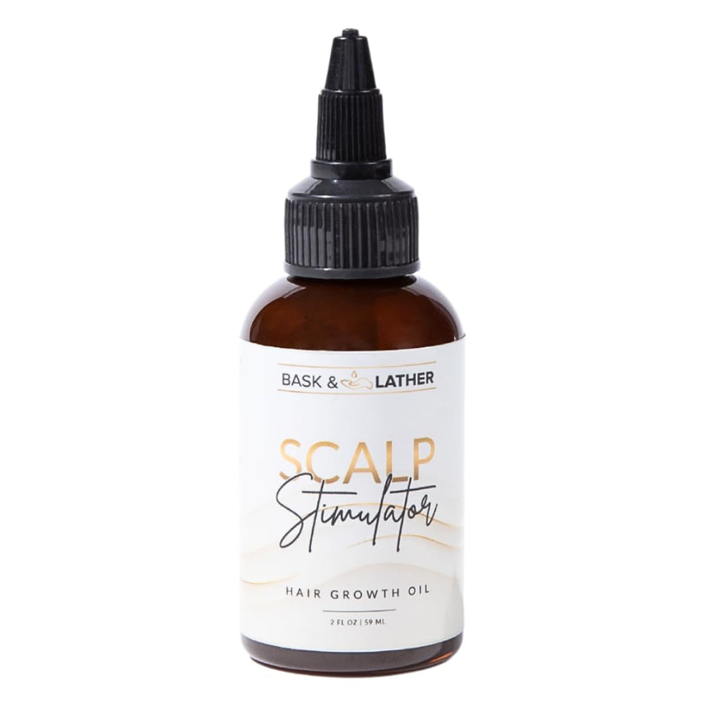Bask and Lather scalp stimulator bottle closeup with mint rosemary blend for healthy scalp.