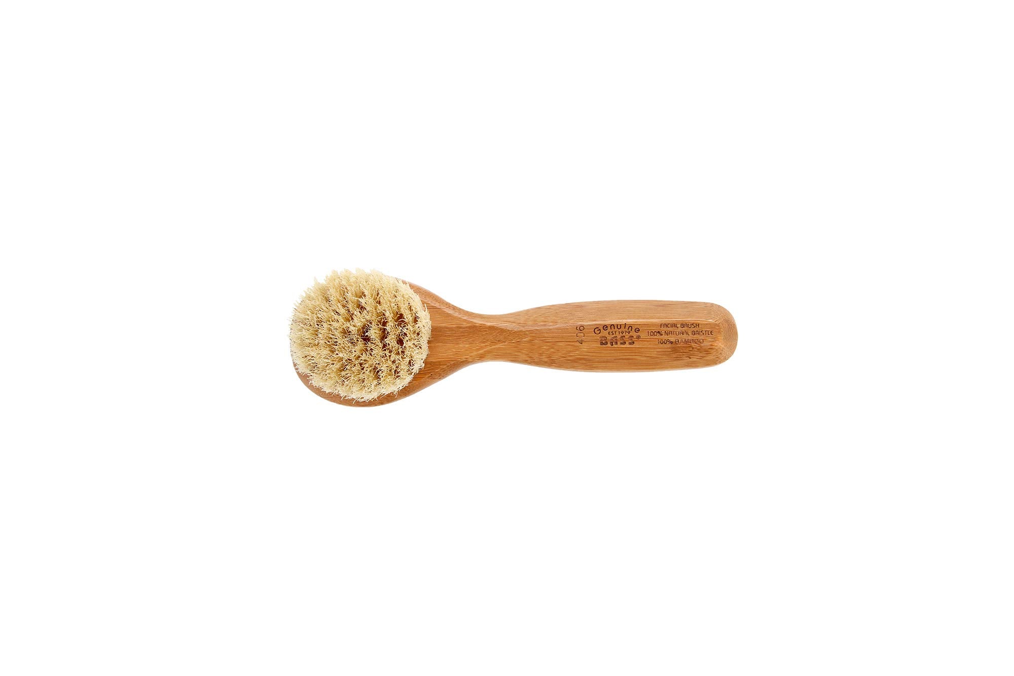 Bass Facial Cleansing Brush in hand demonstrating portable skin care tool.