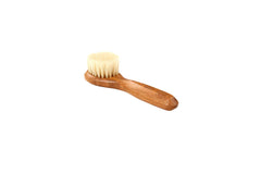 Bass Facial Cleansing Brush under water showing gentle lathering.