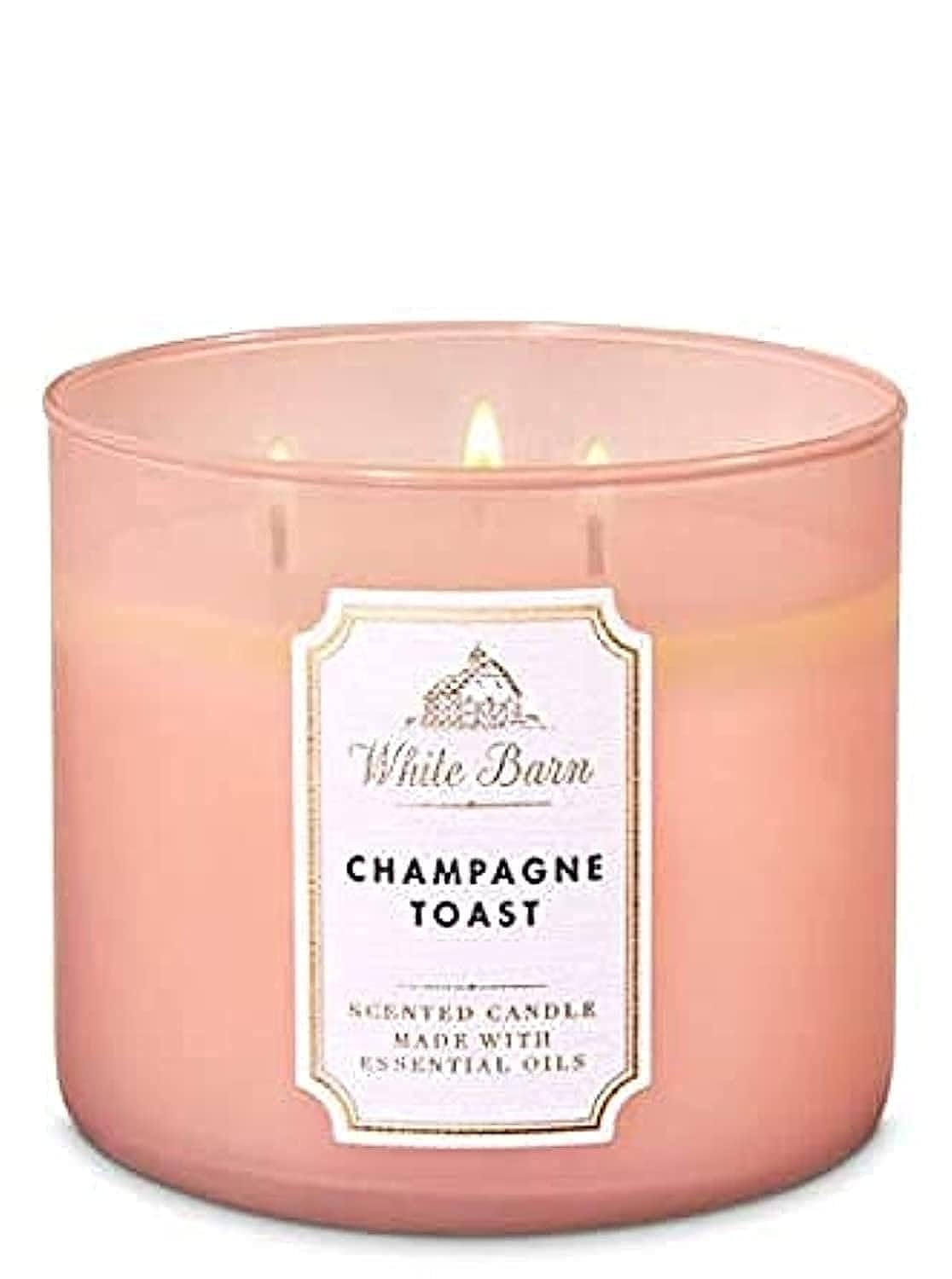 Bath & Body Works Champagne Toast 3-Wick candle jar creates warm ambiance for entertaining