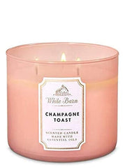 Bath & Body Works Champagne Toast 3-Wick candle jar creates warm ambiance for entertaining